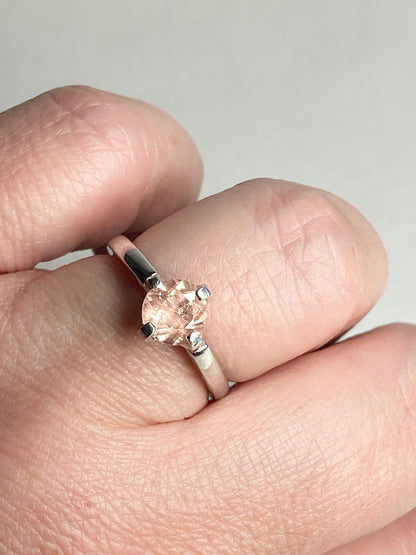 Sterling silver ring with a round, light peach Oregon sunstone.