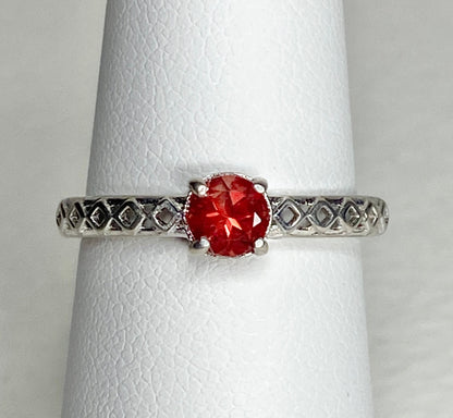 Sterling silver ring with a light red Oregon sunstone and diamond trellis design.