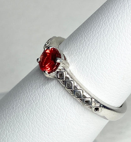 Sterling silver ring with a red sunstone and diamond trellis design.