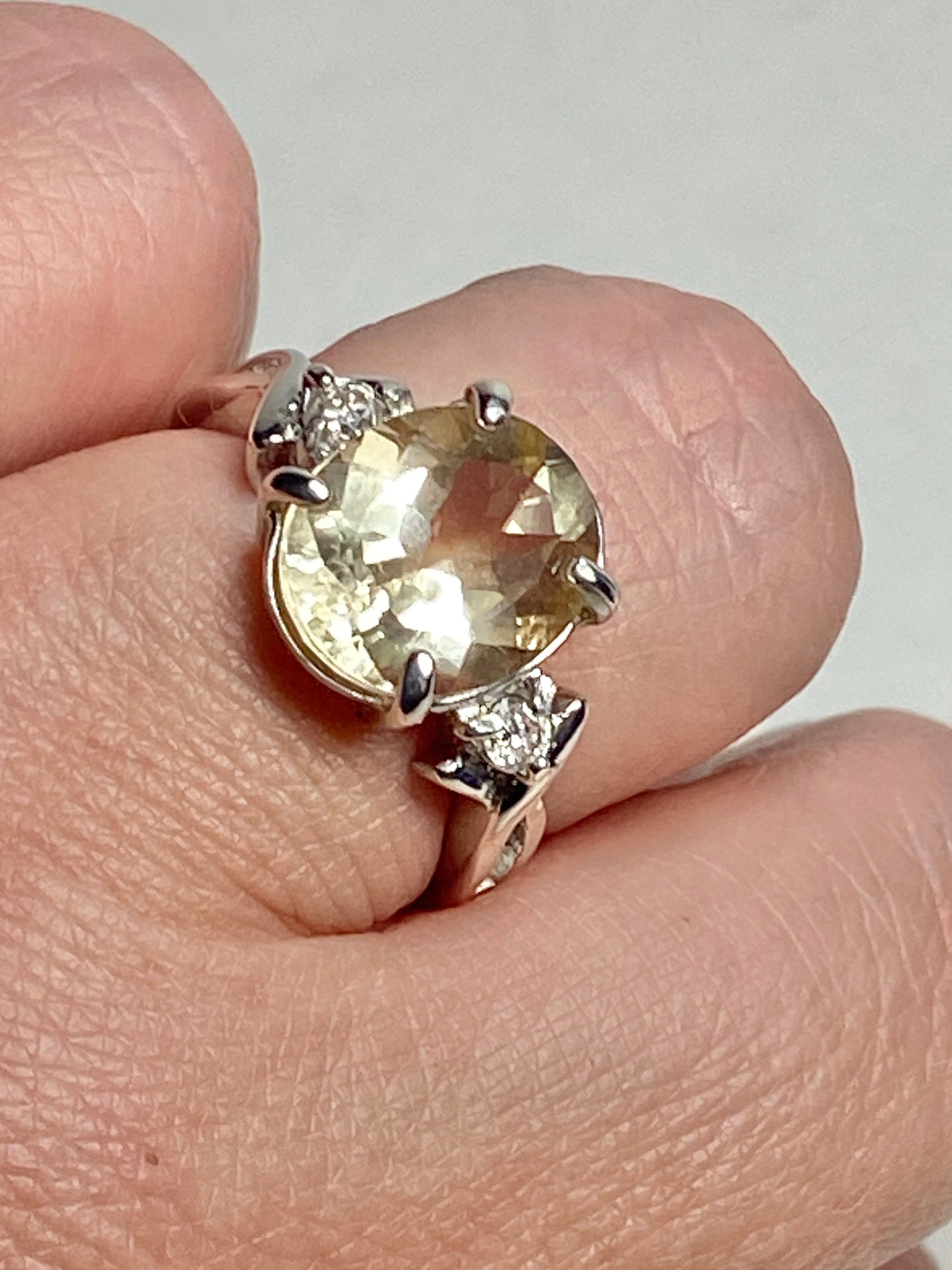 Sterling silver ring with oval Oregon sunstone and two diamonds.