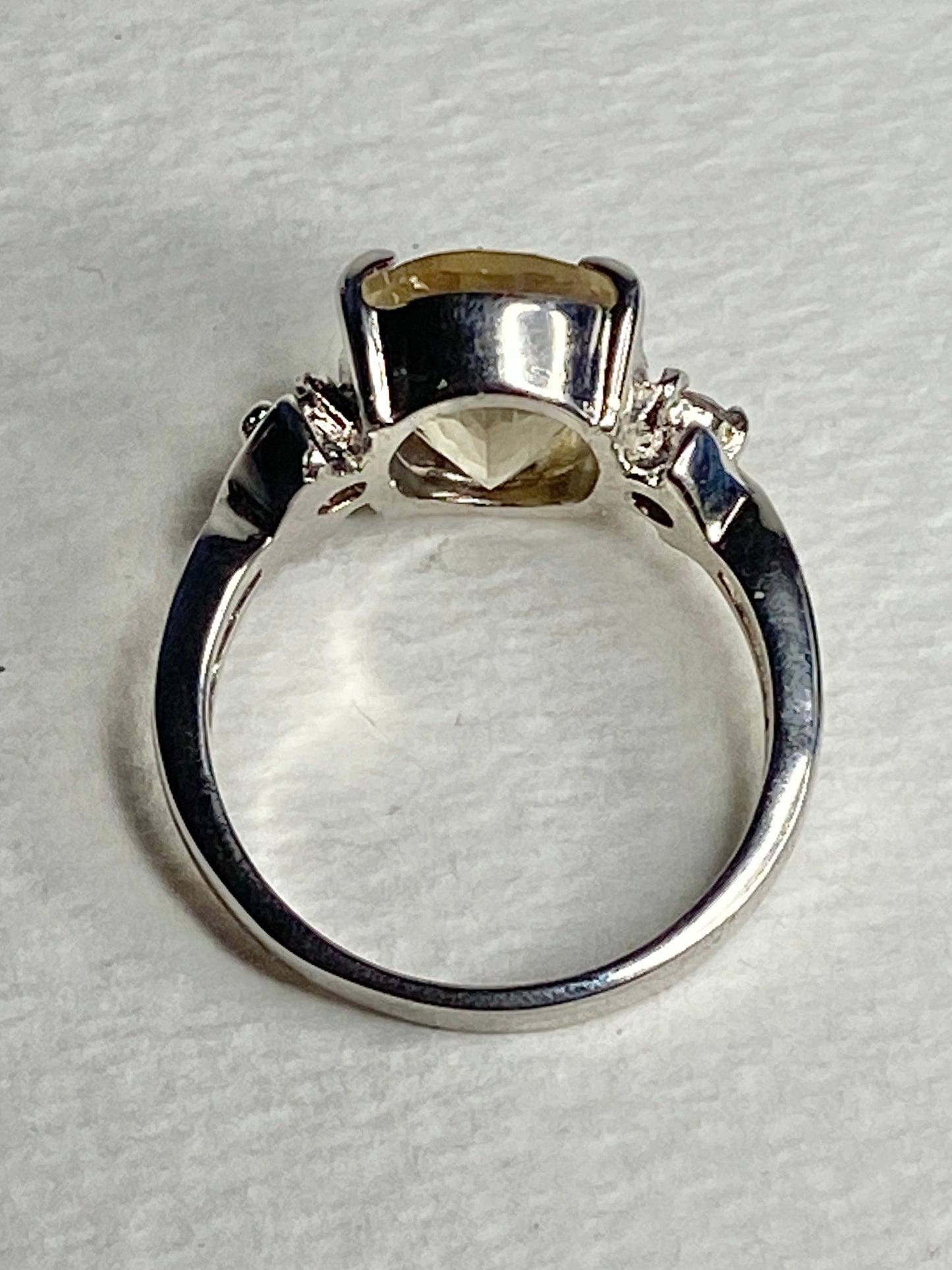Sterling silver ring with an oval Oregon sunstone and two diamonds.