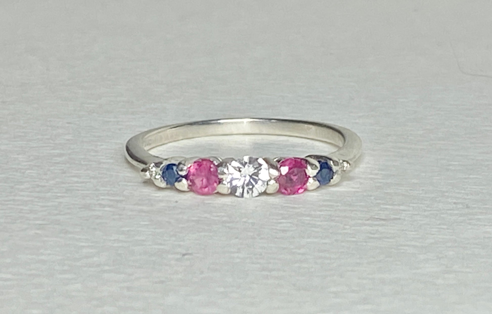Patriotic sterling silver ring with sapphire, ruby, and diamond accents.