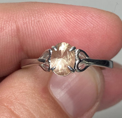 Sterling silver ring with a light peach oval Oregon sunstone.