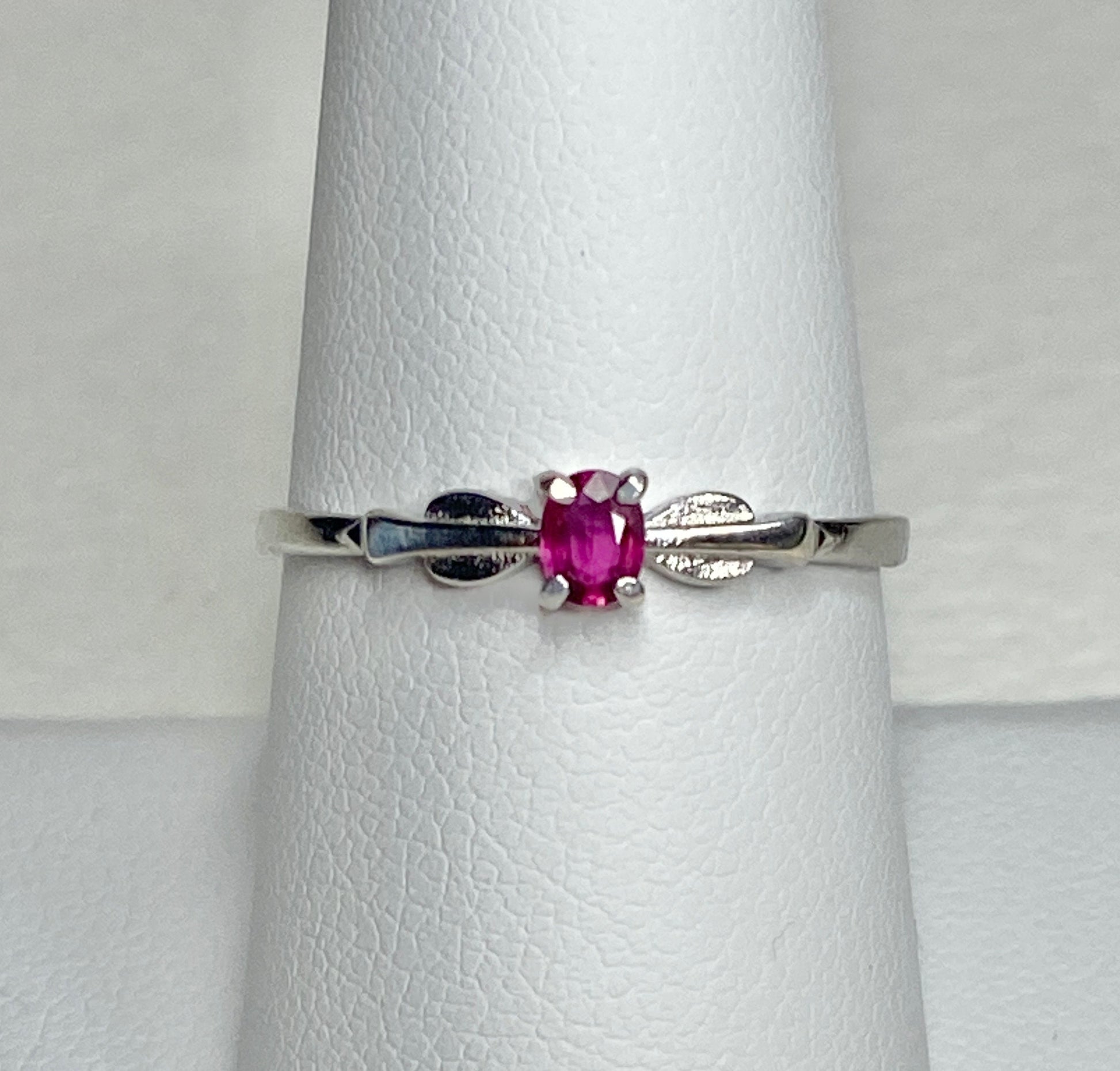 Sterling silver ring with a Burmese ruby in a spade arrowhead design.