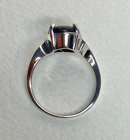 Sterling silver ring with a star night pinfire boulder opal.