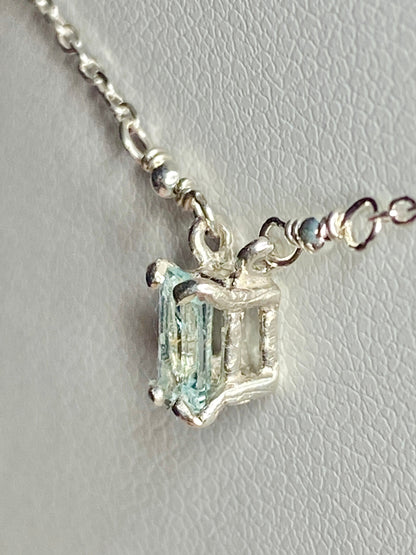 Sterling silver necklace featuring a rectangular cuprian tourmaline pendant.
