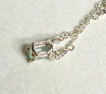 Sterling silver necklace with a cuprian tourmaline pendant.