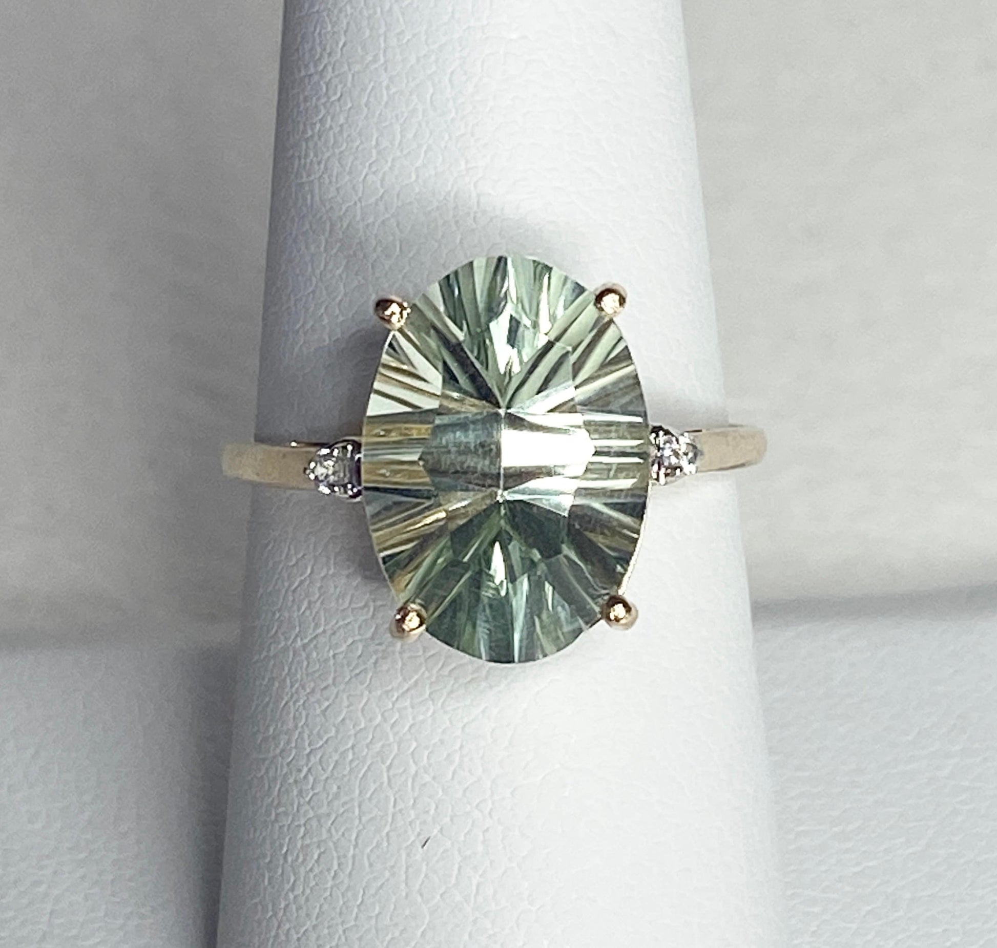 Oval fancy cut prasiolite green quartz ring with zircon accents in 9k yellow gold.