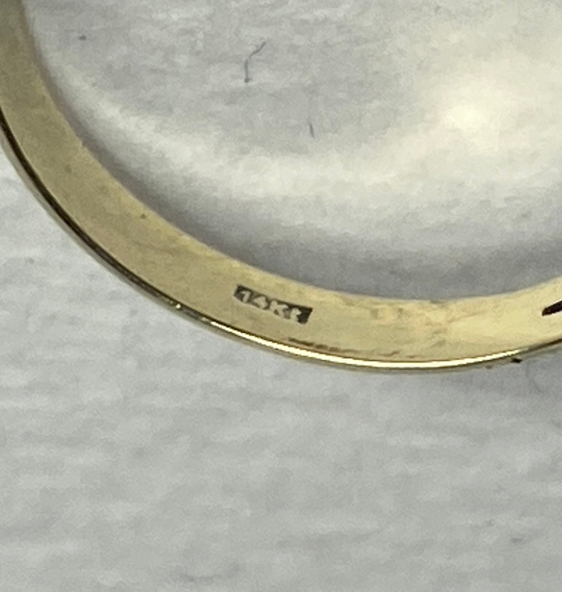 14k gold ring with a rose cut garnet daisy cluster design.