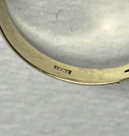 14k gold ring with a rose cut garnet daisy cluster design.