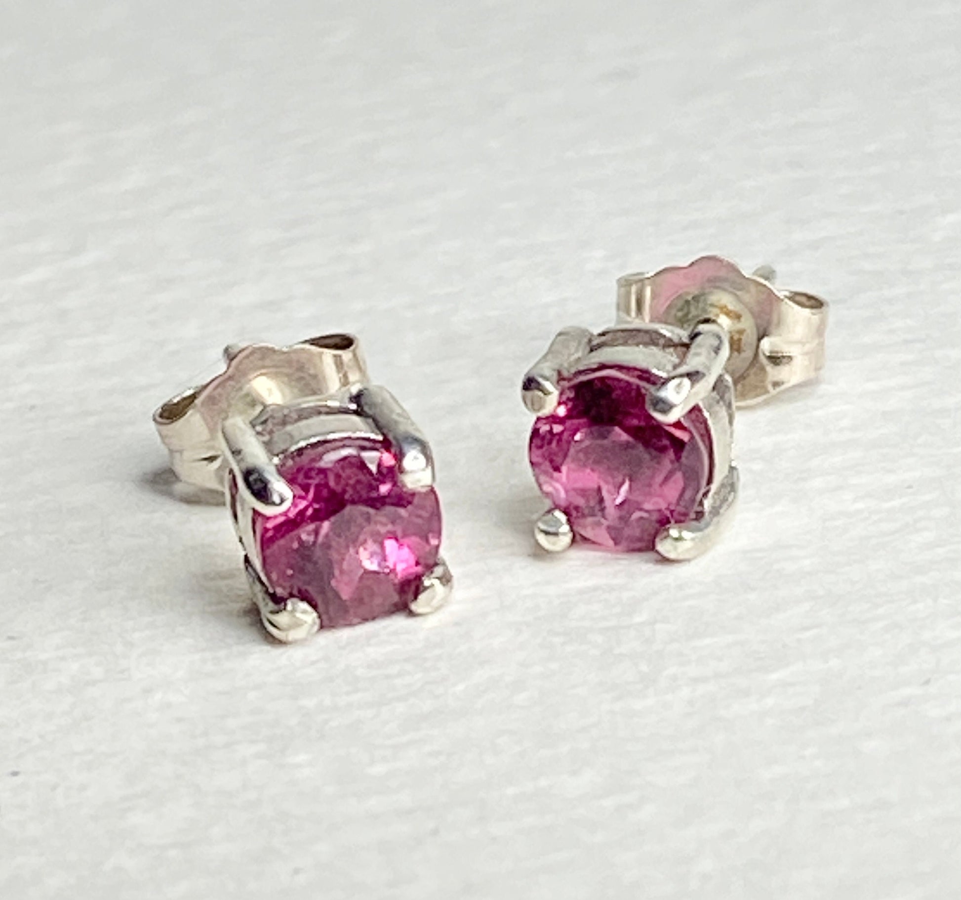 Purplish-pink rubellite tourmaline 5mm stud earrings in sterling silver.