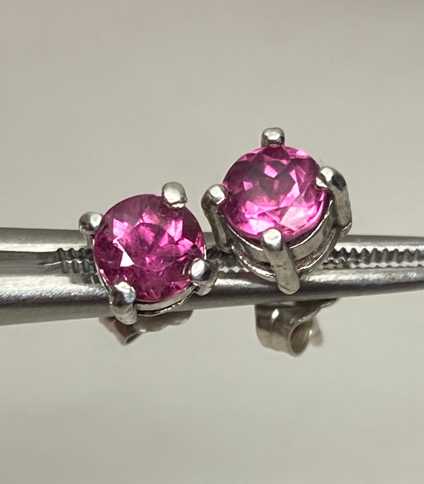 Purplish-pink rubellite tourmaline 5mm stud earrings in sterling silver.