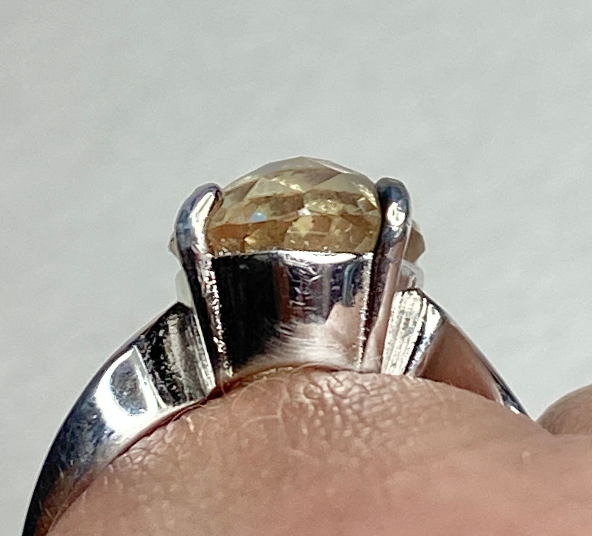 Sterling silver ring with a checkerboard faceted yellow Oregon sunstone.