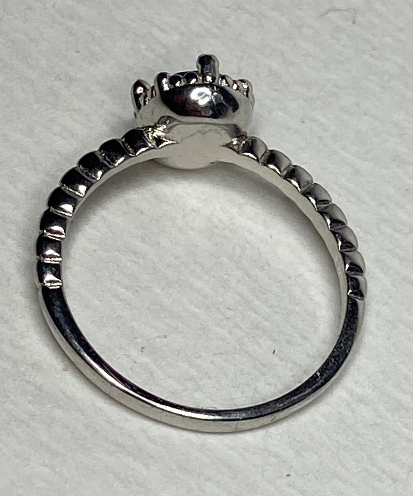 Sterling silver ring with a peach Oregon Sunstone and beaded band.