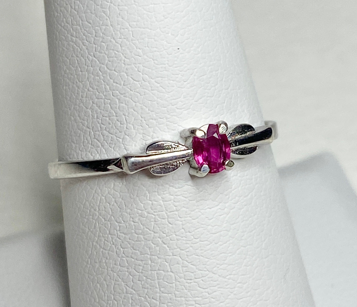 Petite Burmese ruby ring in sterling silver with a spade arrowhead design.