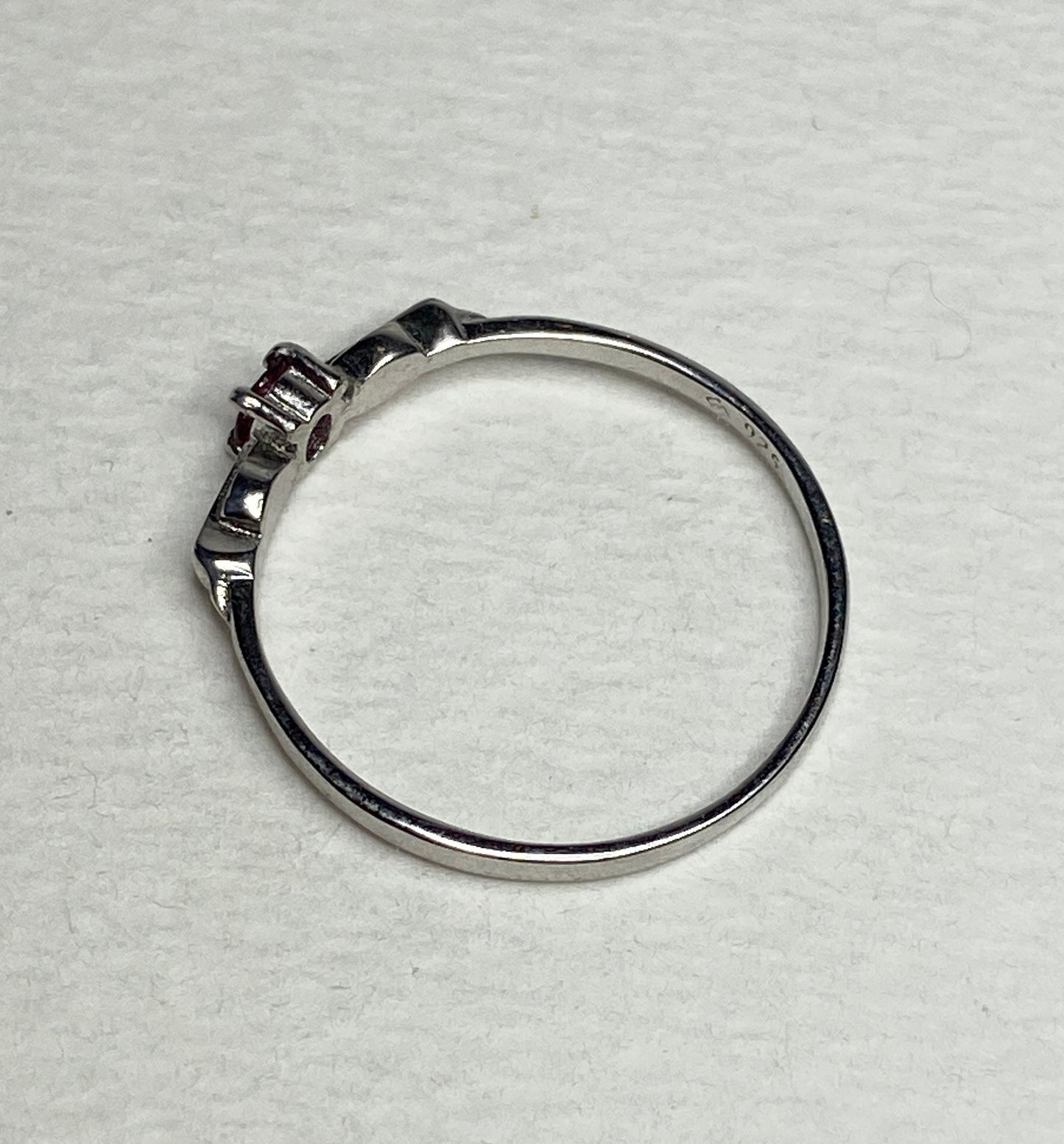 Petite Burmese ruby spade arrowhead design ring in sterling silver.