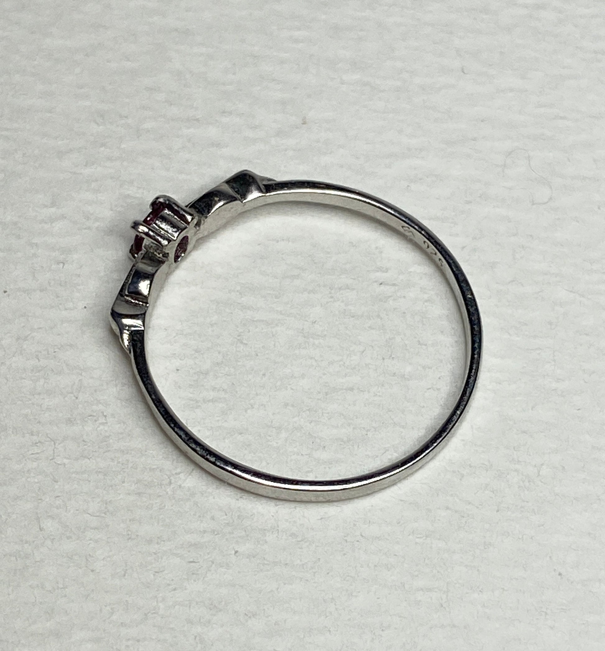 Petite Burmese ruby spade arrowhead design ring in sterling silver.