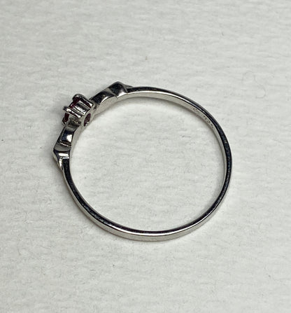 Petite Burmese ruby spade arrowhead design ring in sterling silver.