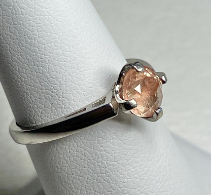 Sterling silver ring with a round, light peach Oregon sunstone.