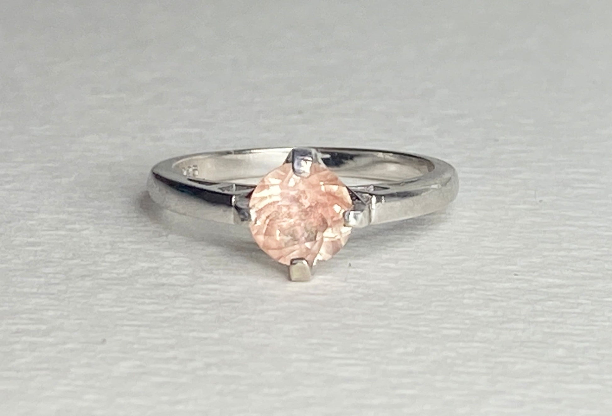 Sterling silver ring with a marquise-cut peach sunstone.