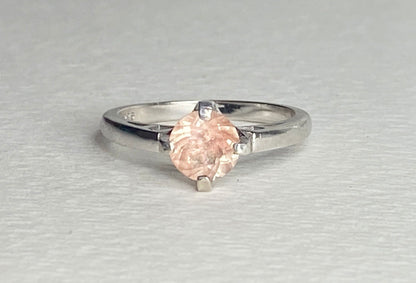 Sterling silver ring with a marquise-cut peach sunstone.