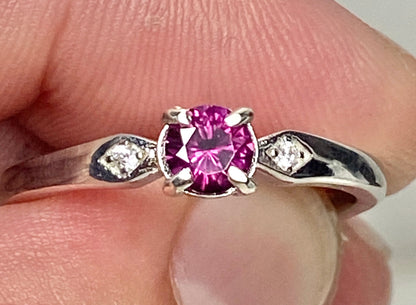 Idaho grape rhodolite garnet and sterling silver band ring with two small cz accents.