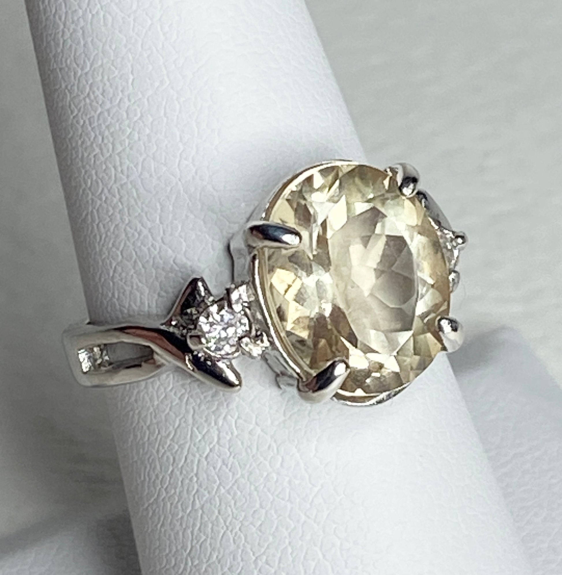 Sterling silver ring with oval Oregon sunstone and two diamonds.