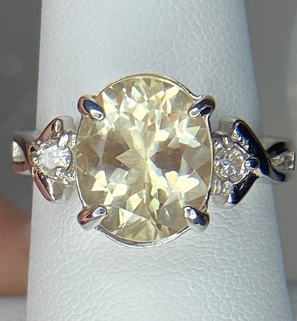 Sterling silver ring with oval Oregon sunstone and two round diamonds.