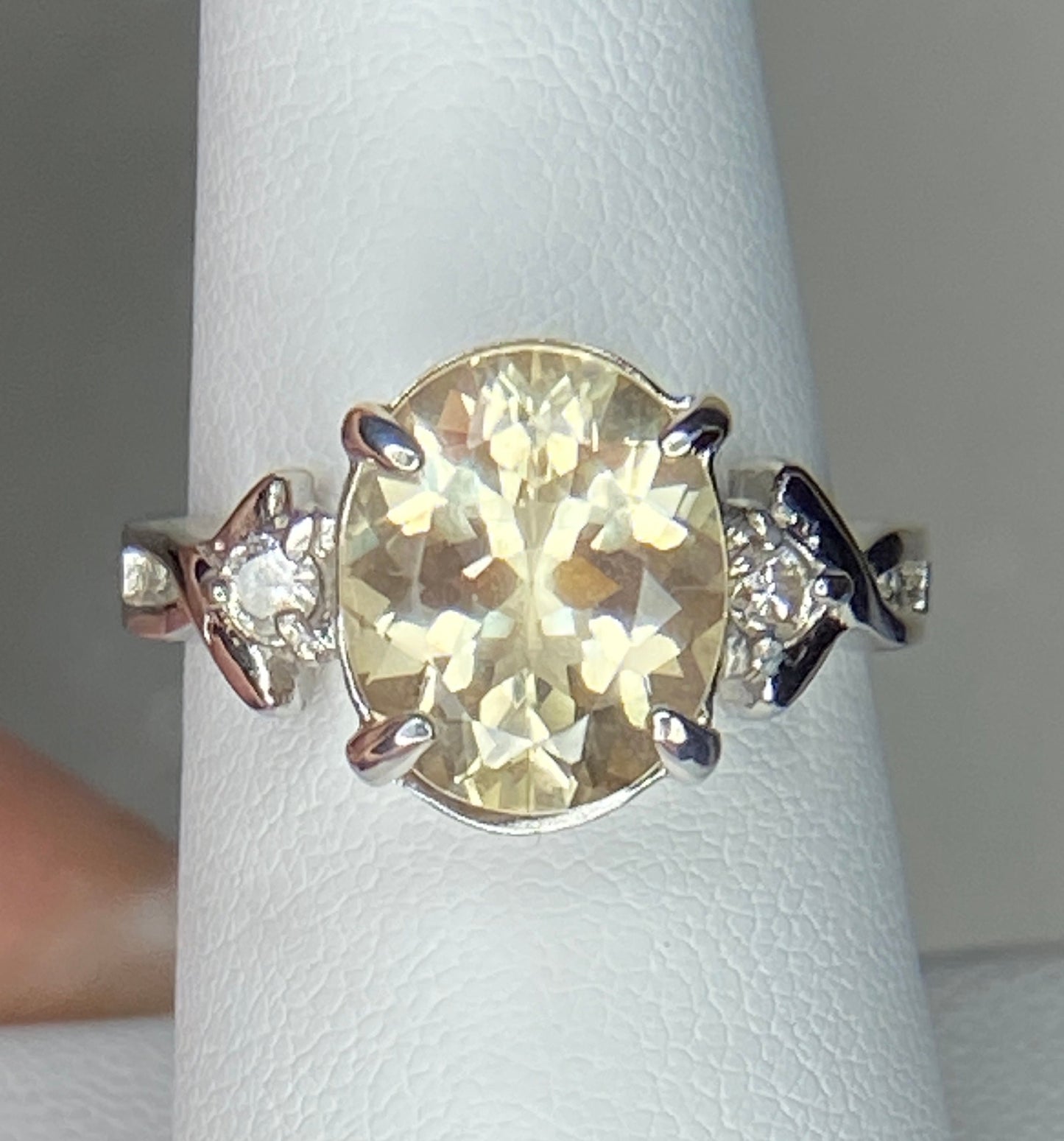 Sterling silver ring with oval Oregon sunstone and two diamonds.