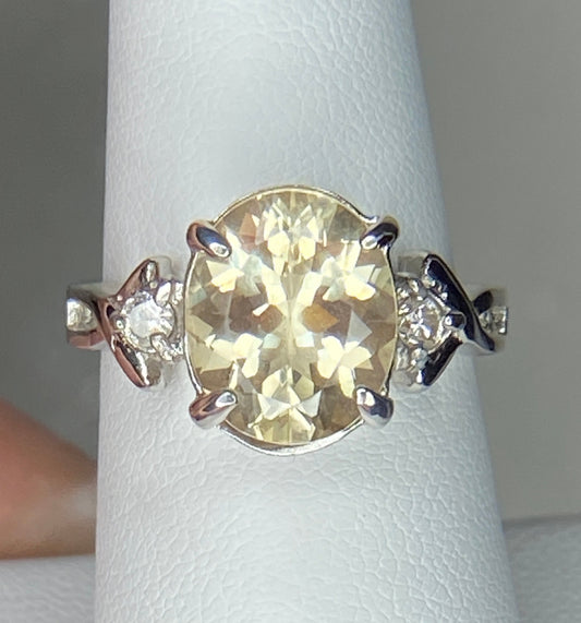 Sterling silver ring with oval Oregon sunstone and two diamonds.