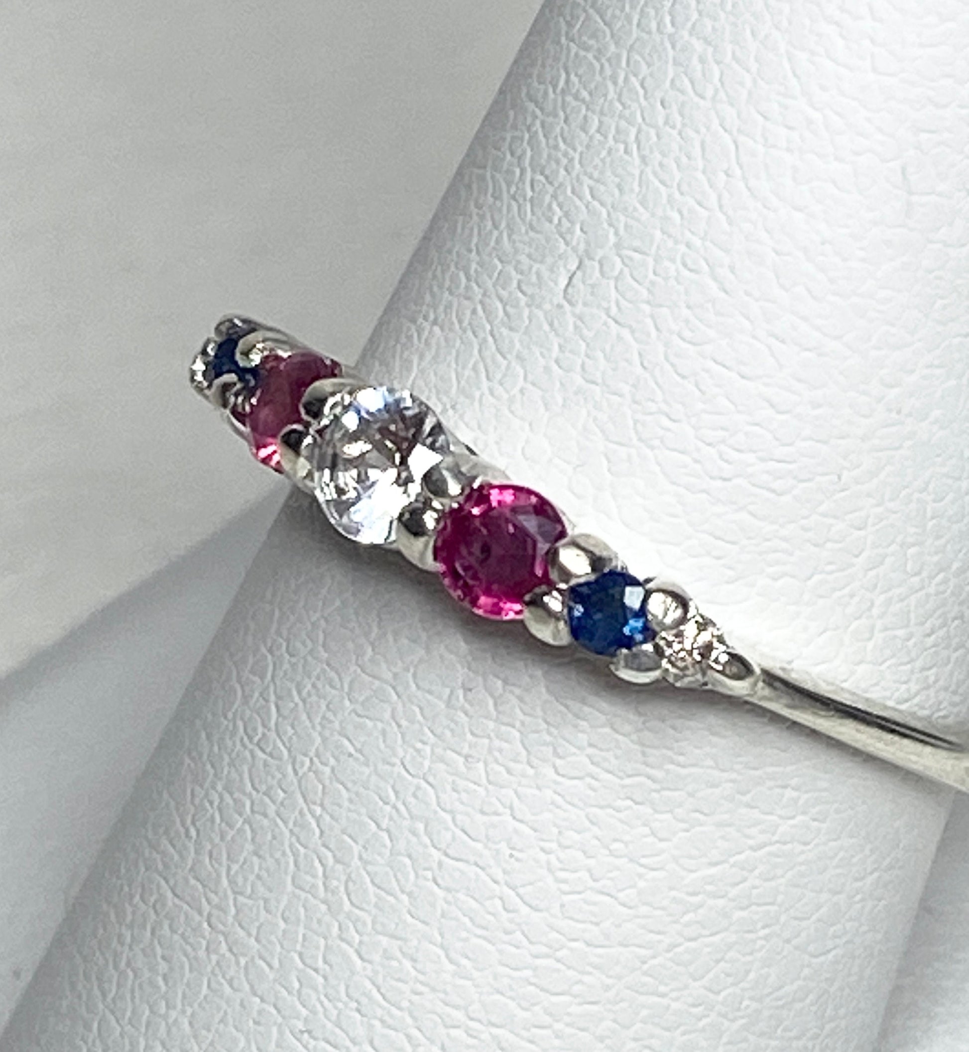 Sterling silver ring with sapphire, ruby, and diamond stones.