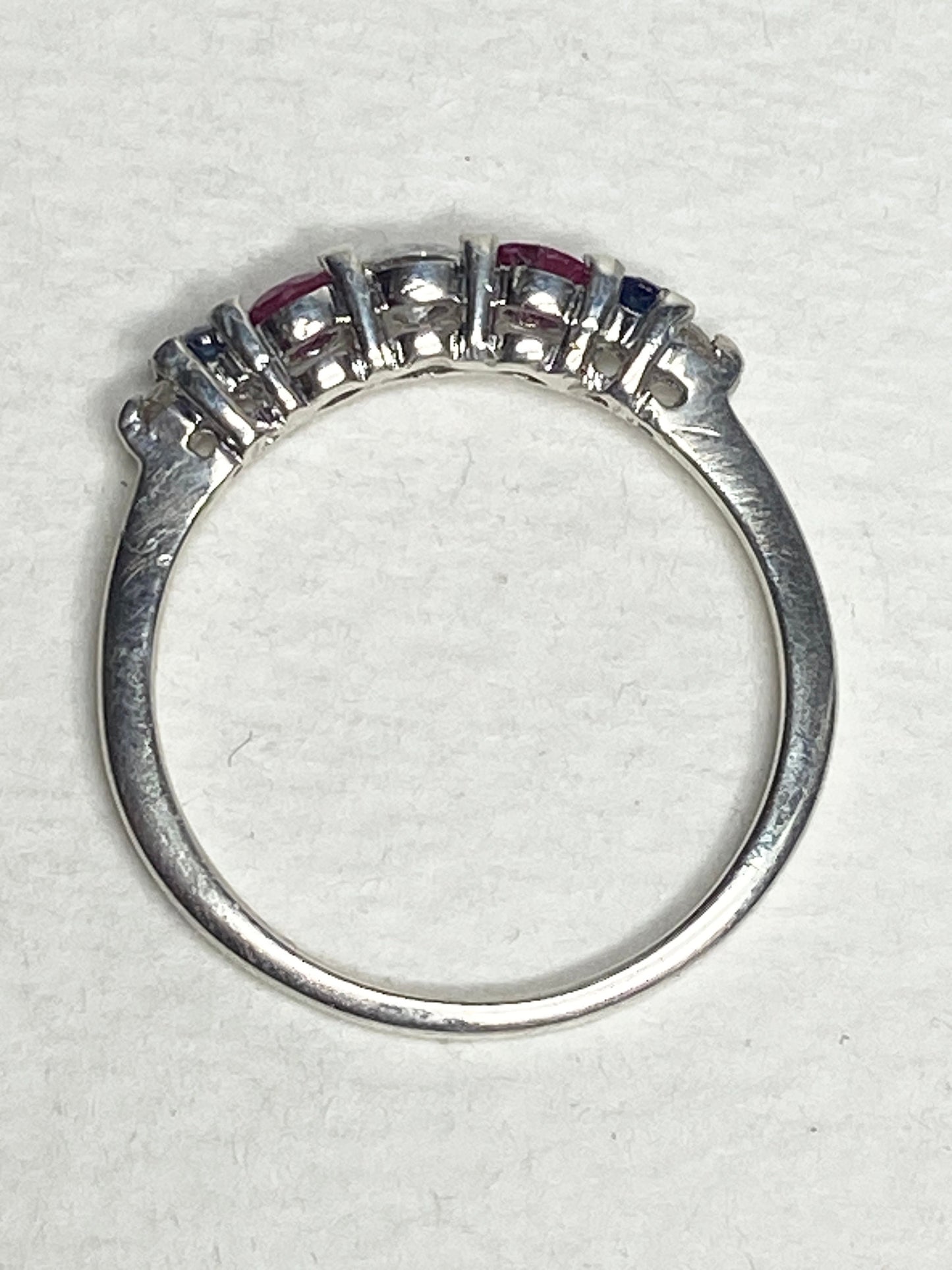 Sterling silver ring with sapphires, rubies, and diamonds.