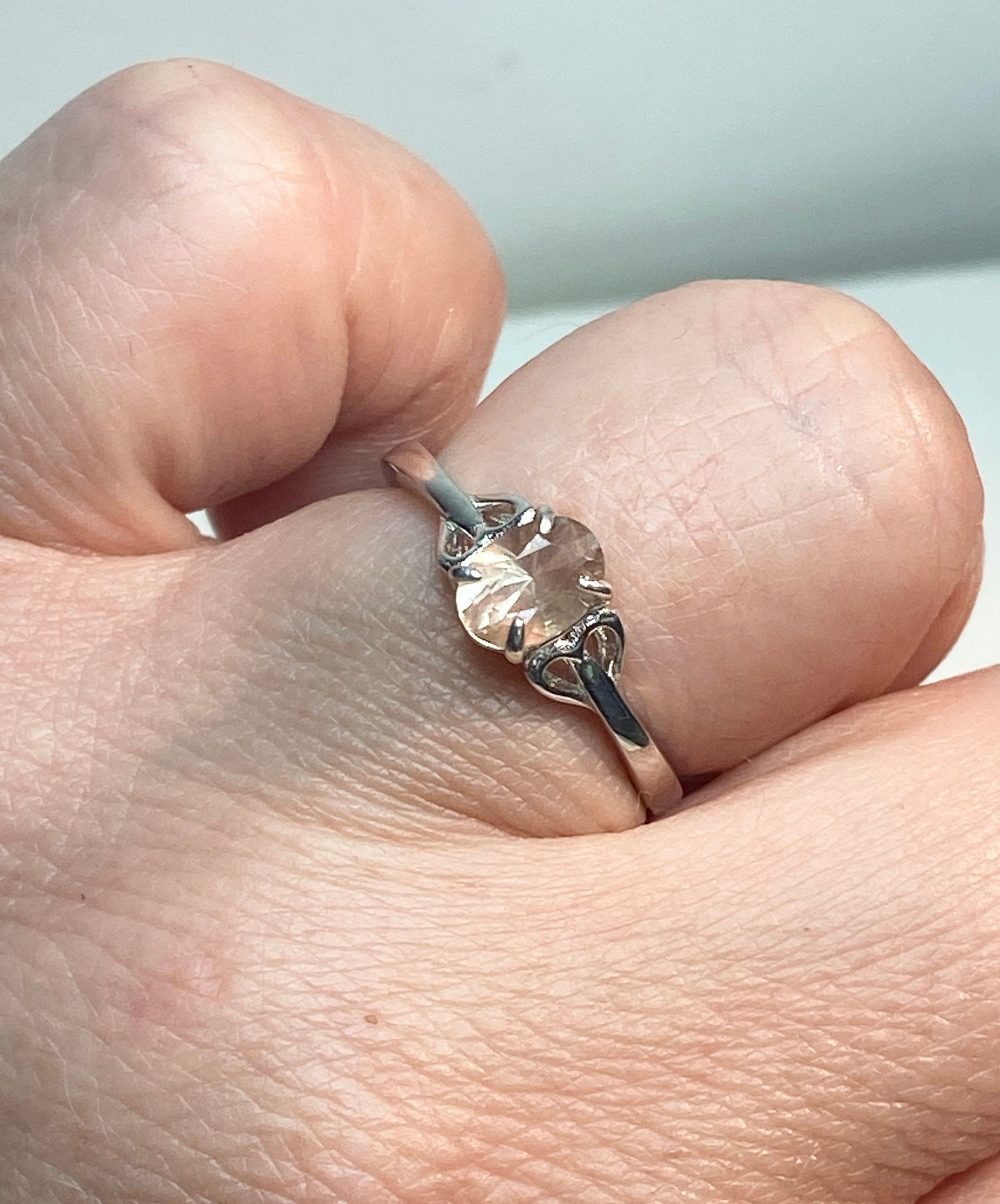 Sterling silver ring with a light peach oval Oregon sunstone.