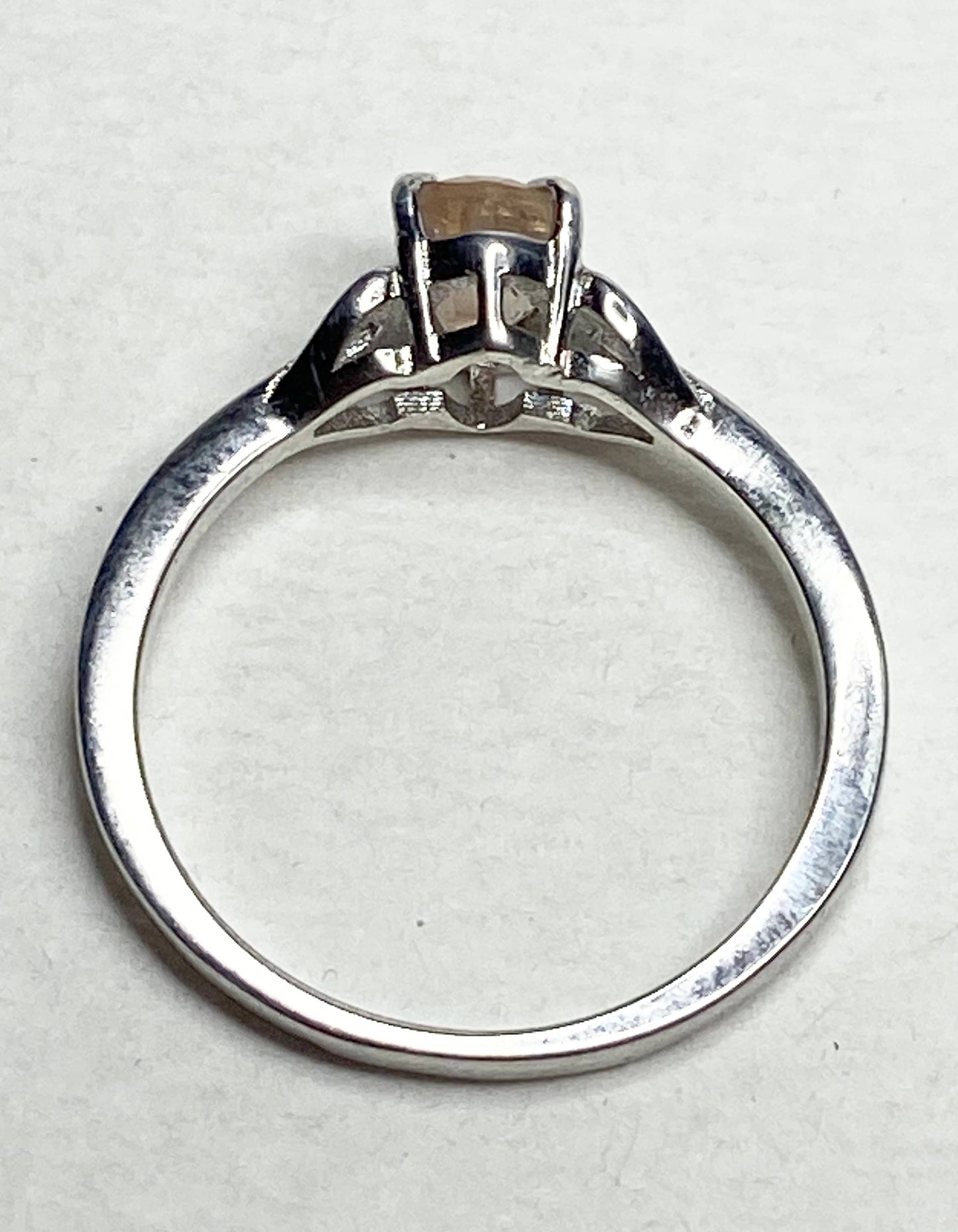 Sterling silver ring with a light peach oval Oregon sunstone.