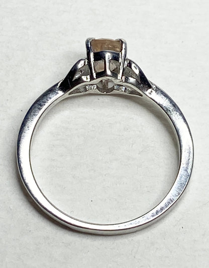 Sterling silver ring with a light peach oval Oregon sunstone.