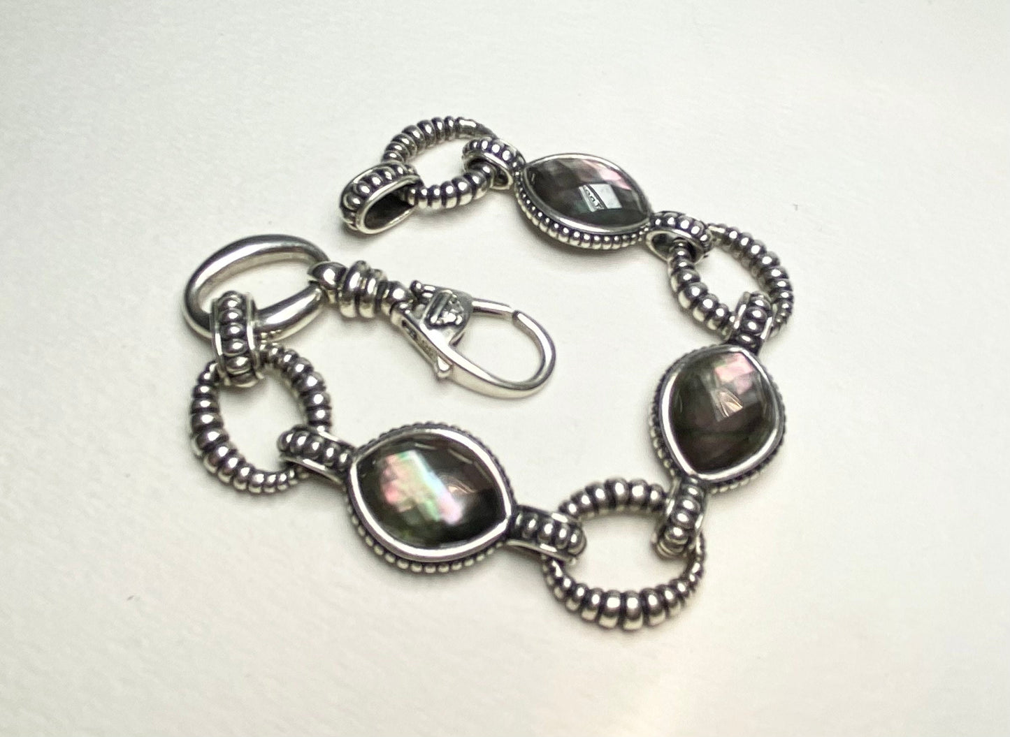 Lagos sterling silver bracelet with Tahitian black lipped oyster mother of pearl and quartz doublet.