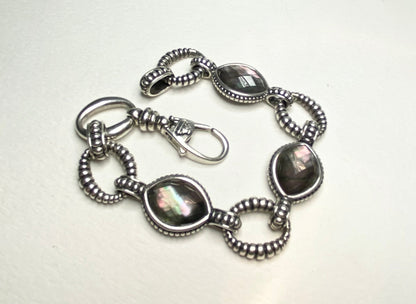 Lagos sterling silver bracelet with Tahitian black lipped oyster mother of pearl and quartz doublet.