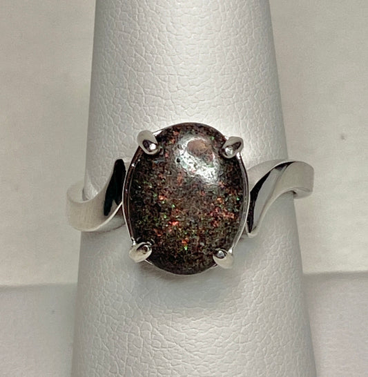 Oval pinfire boulder opal ring in sterling silver.
