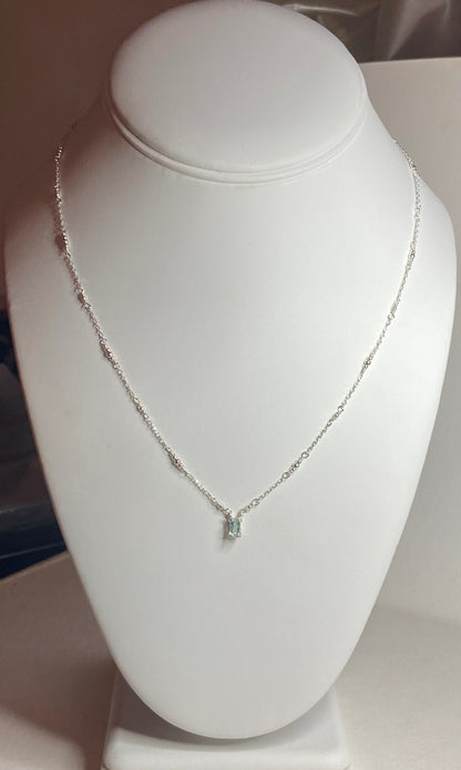 Sterling silver necklace with a rectangular cuprian tourmaline pendant.