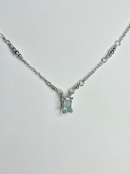 Sterling silver necklace with a rectangular cuprian tourmaline pendant.