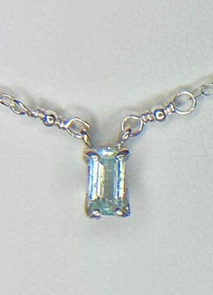 Sterling silver necklace with a rectangular cuprian tourmaline pendant.