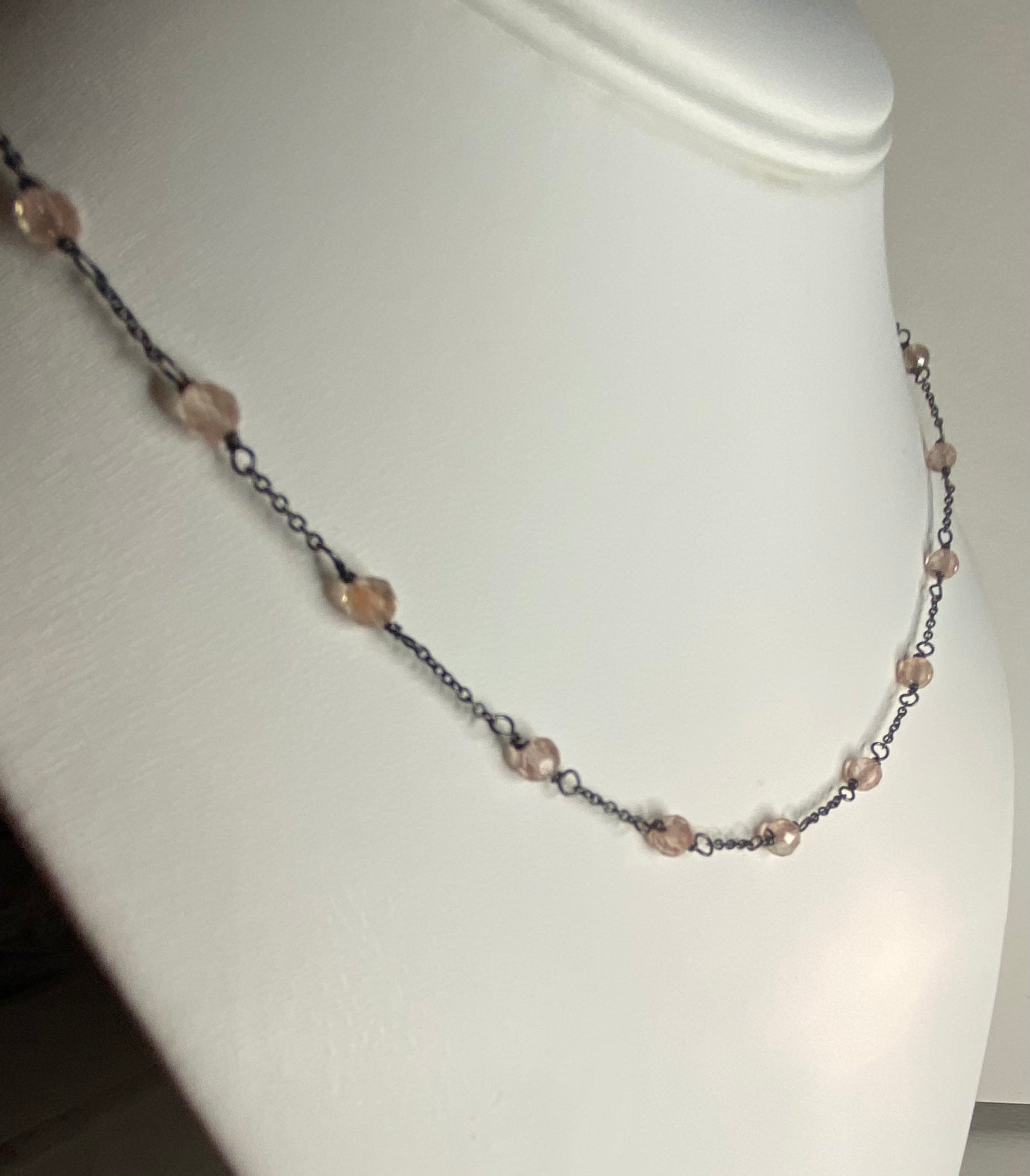Adjustable sterling silver necklace with peach Oregon sunstone beads.