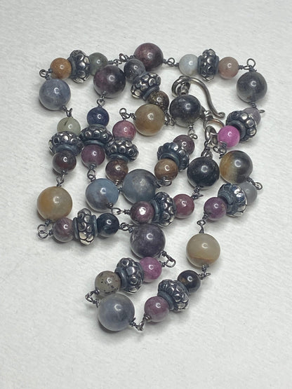 Natural multi-color sapphire corundum beaded necklace with sterling silver accents.