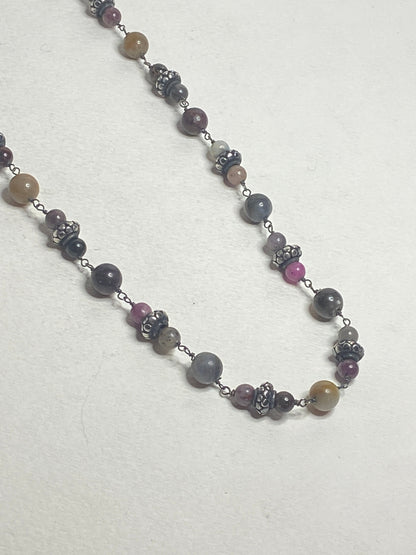 Natural multi-color sapphire corundum beaded necklace with sterling silver accents.