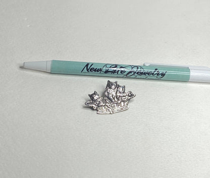 Sterling silver brooch pendant of three cats in a basket.