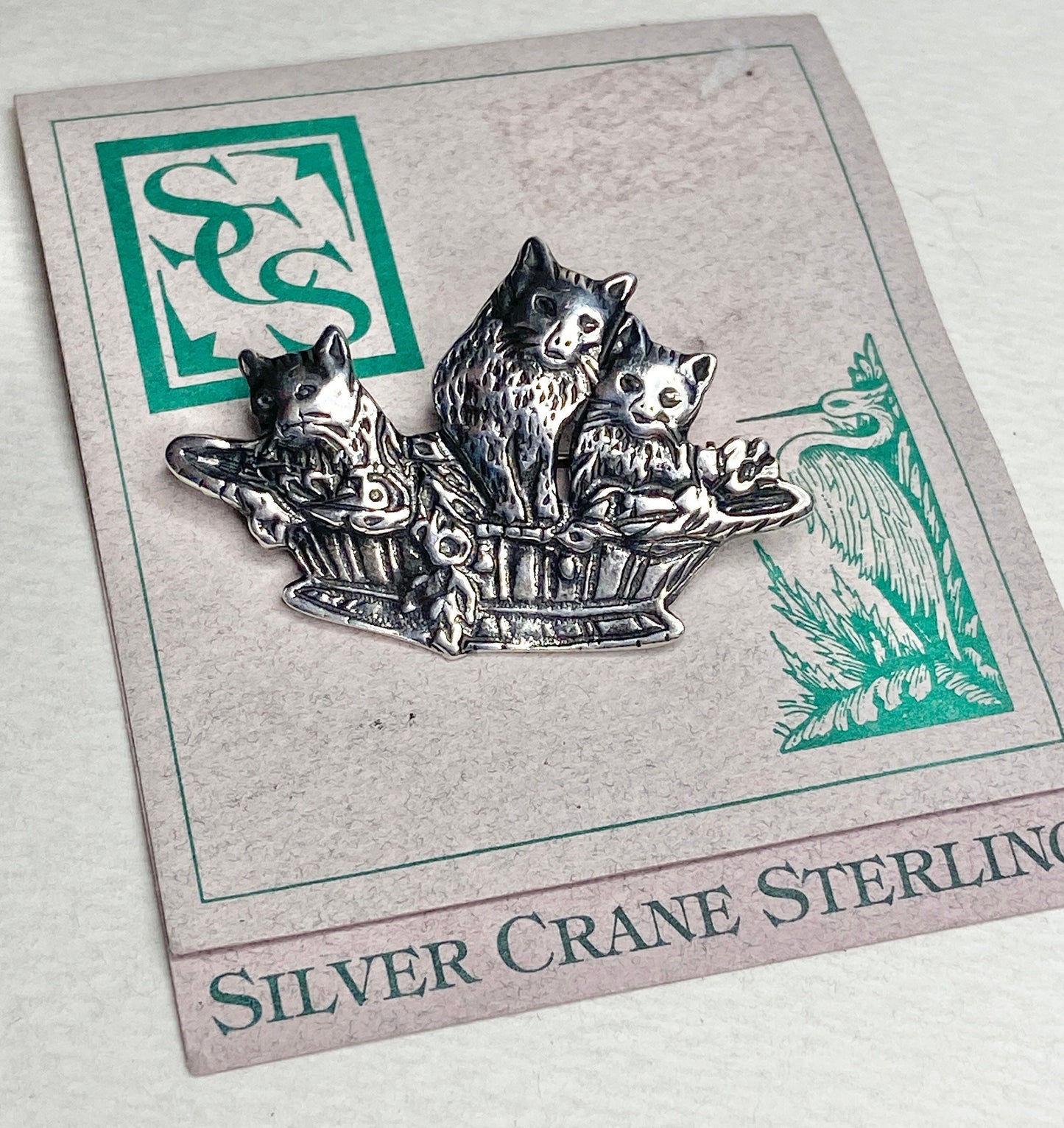 Sterling silver brooch pendant of three cats in a basket by Silver Crane.