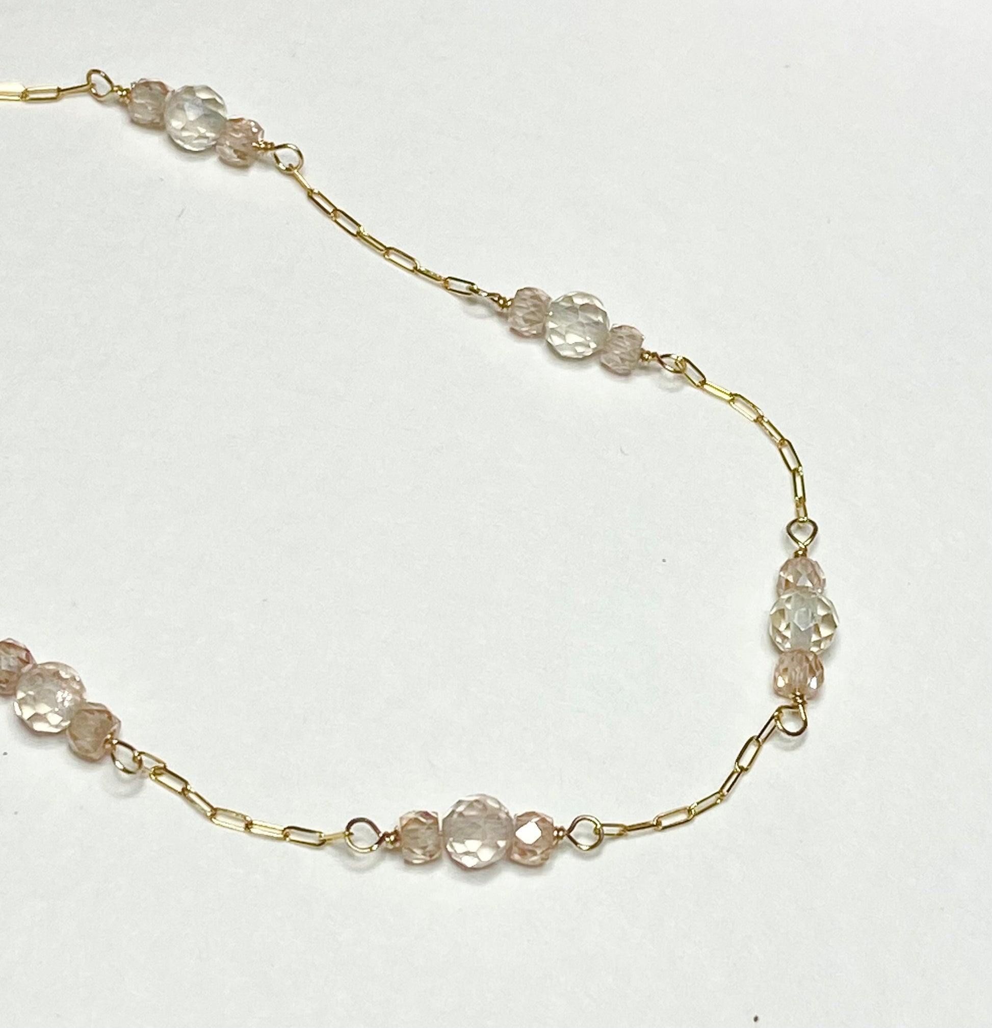 14k yellow gold necklace with Oregon sunstone and zircon stations.