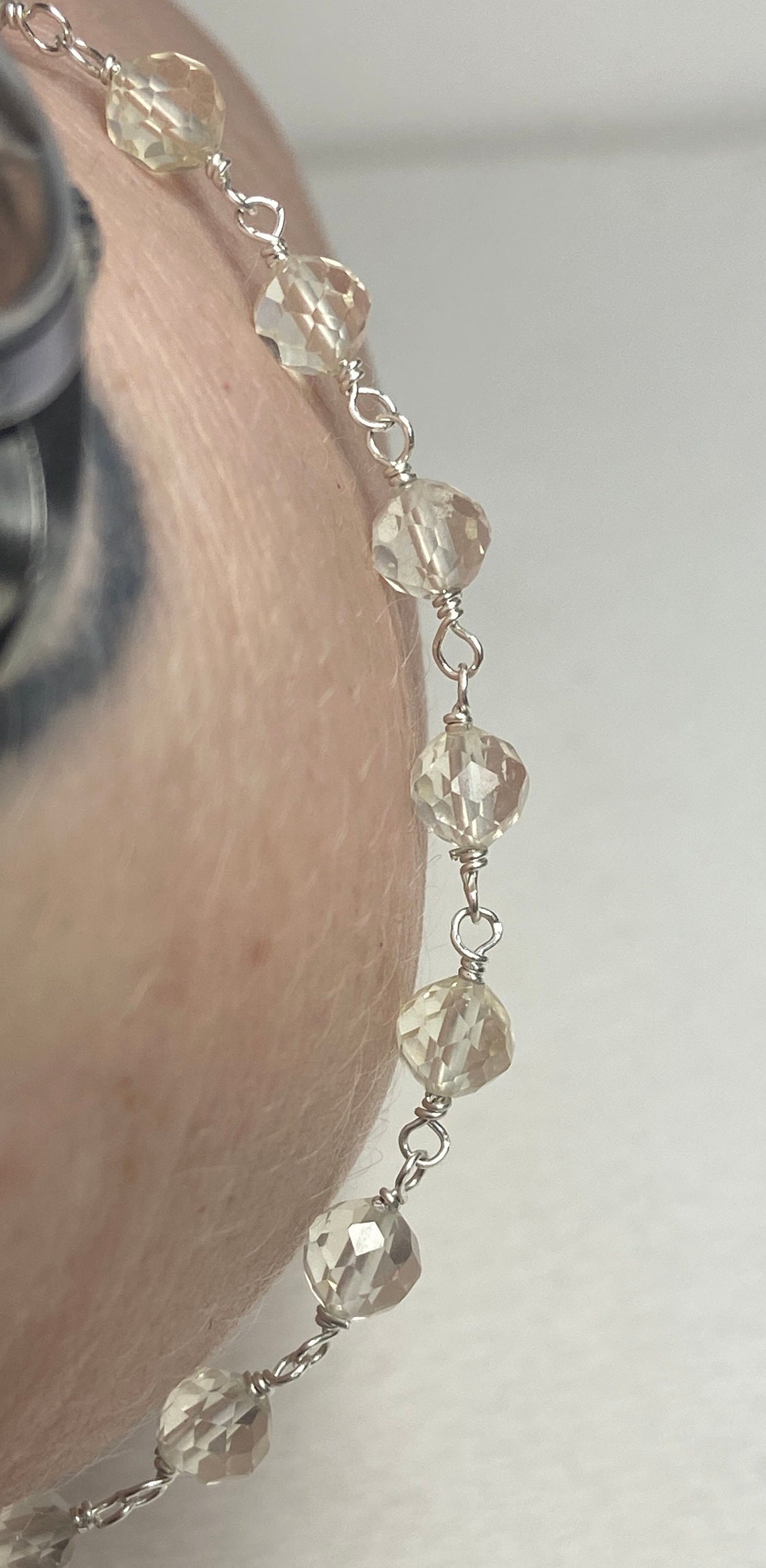 Sterling silver bracelet with faceted yellow Oregon sunstone beads.