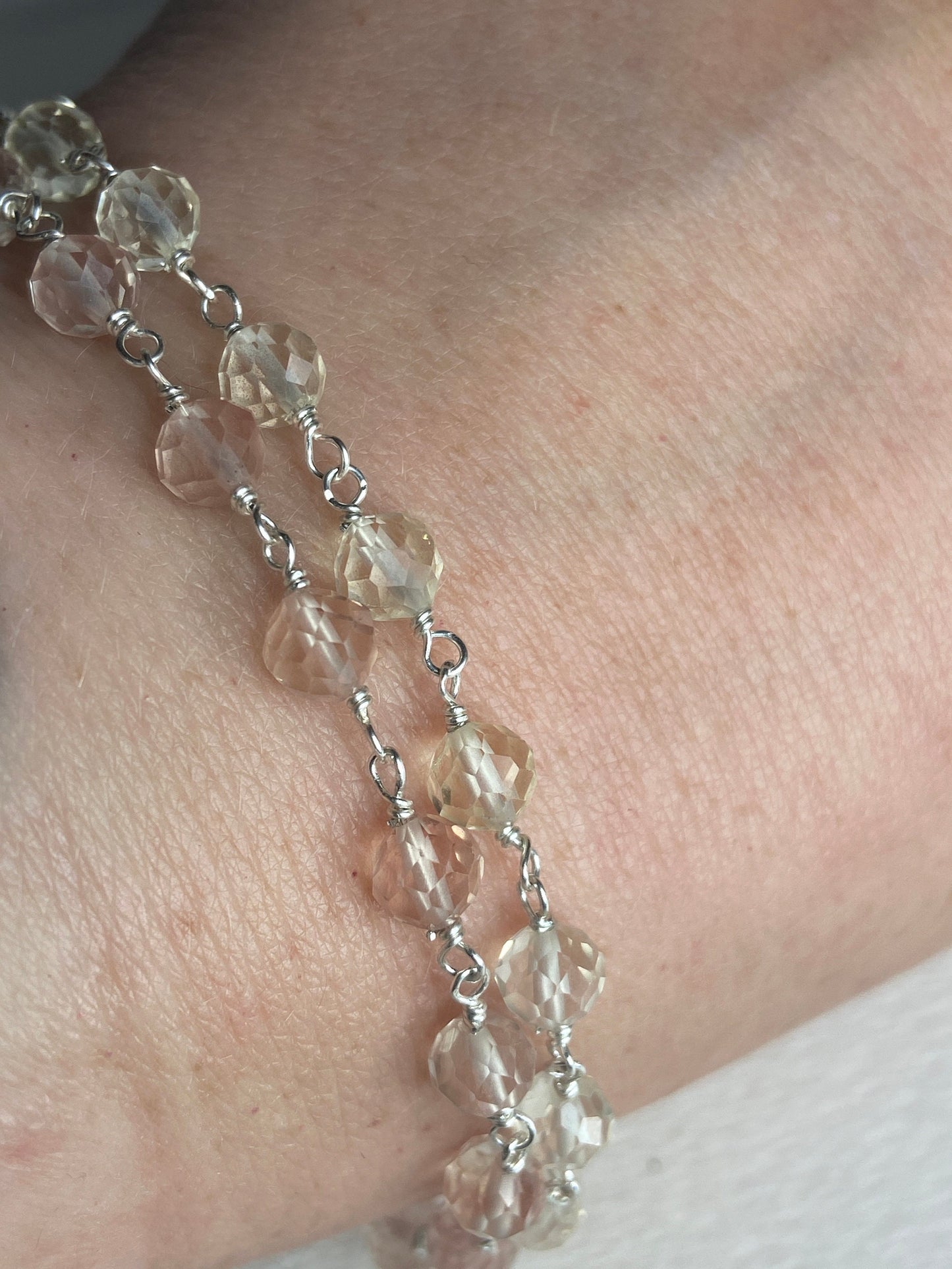 Sterling silver bracelet with faceted yellow Oregon sunstone beads.
