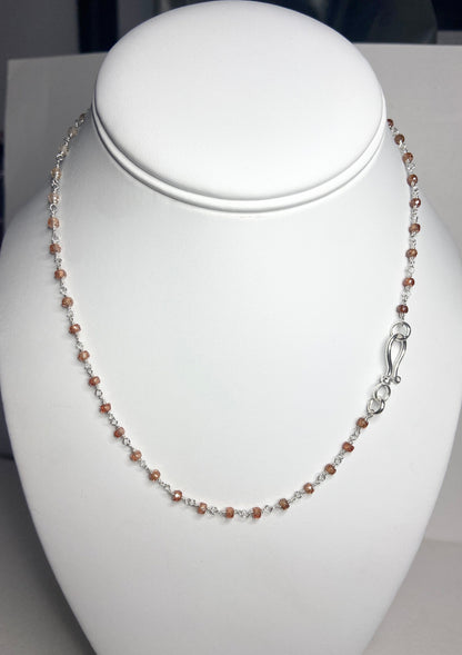 Sterling silver choker necklace with faceted brown zircon beads and a hook clasp.